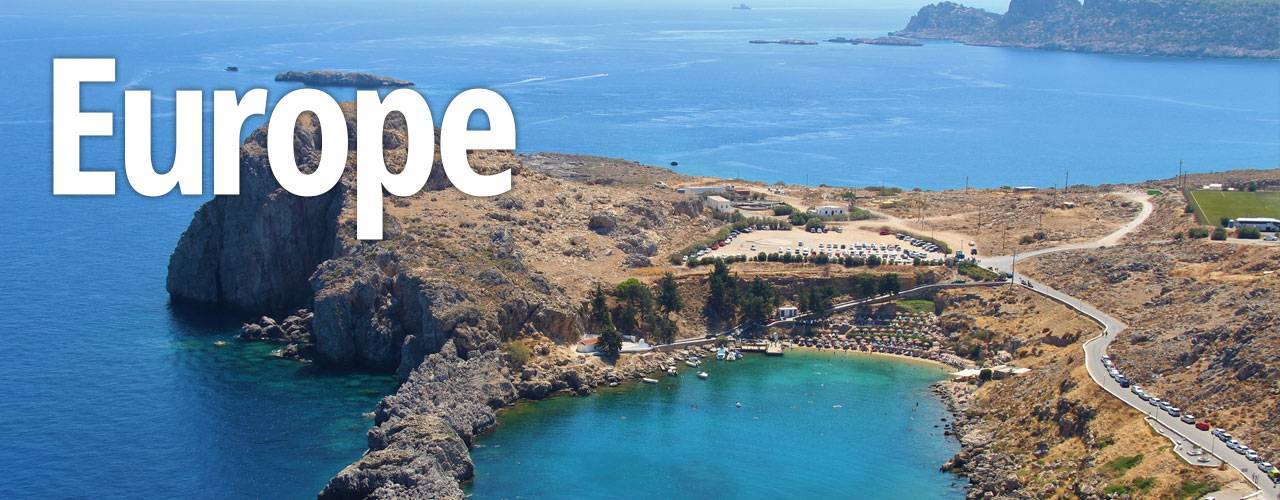 Azure heart shaped sea bay in Lindos, the white city of Rhodes, Greece