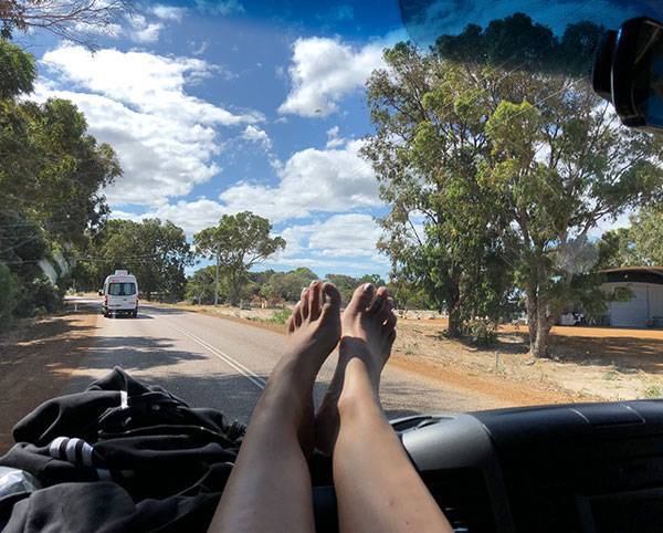 Feet up while travelling in a hire car