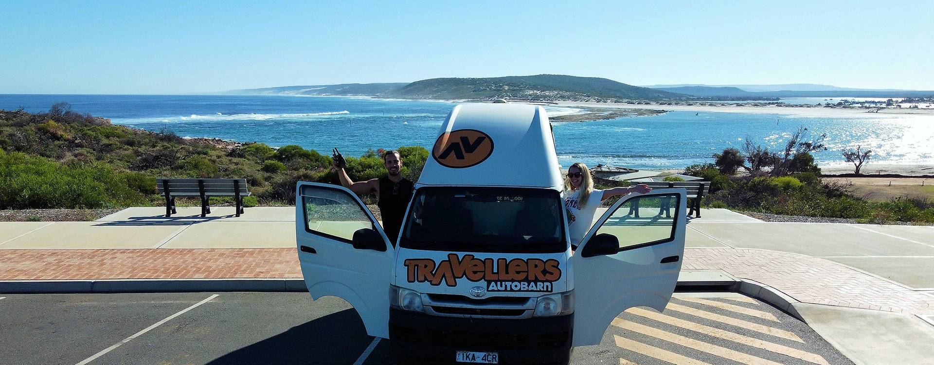 backpackers in campervan on Australian coastline