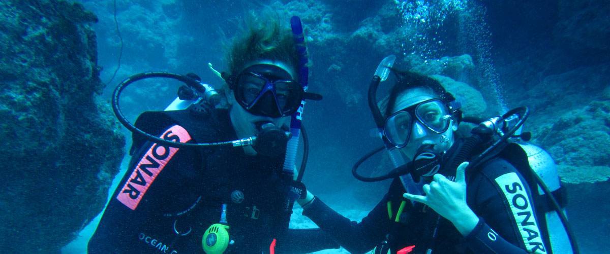 Maya and Evelin scuba diving the Great Barrier Reef, Cairns Australia